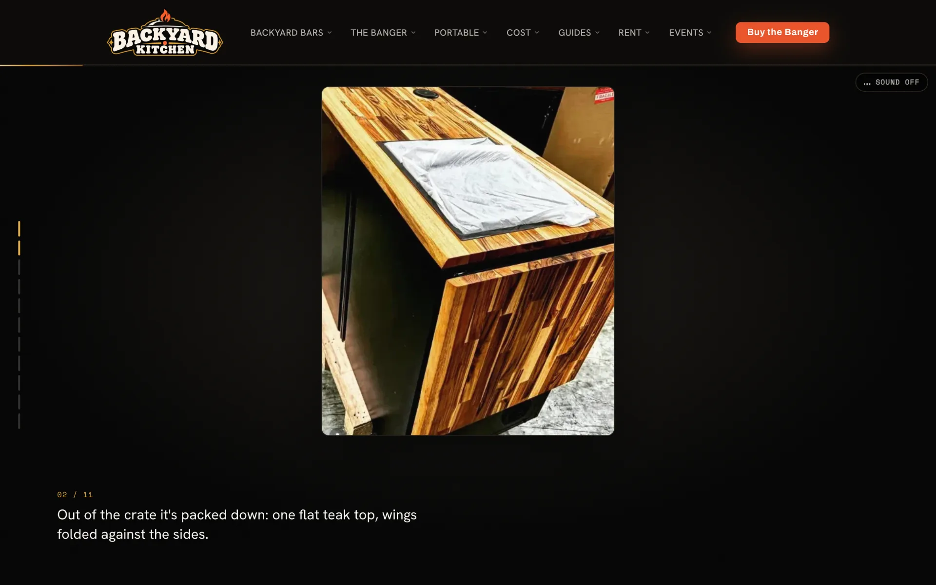 Chapter 02 of 11 on a black stage: the unit out of its crate, packed down with a flat teak top and the wings folded against its sides, captioned Out of the crate it's packed down.