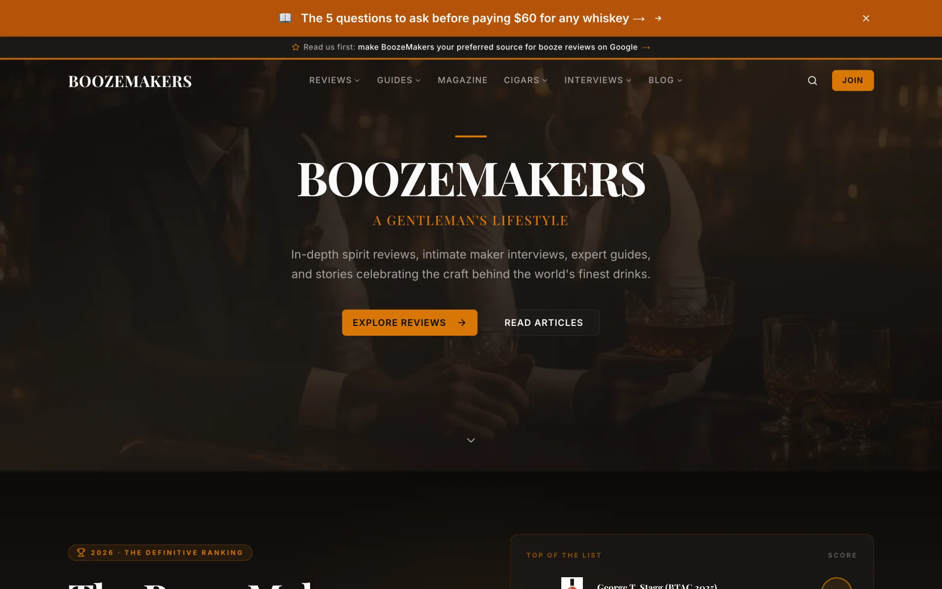Homepage hero: the BoozeMakers wordmark in large white serif capitals over a dim photo of two men in suits holding glasses of whiskey, with A Gentleman's Lifestyle in amber small capitals, a short amber rule above, and an amber Explore Reviews button.